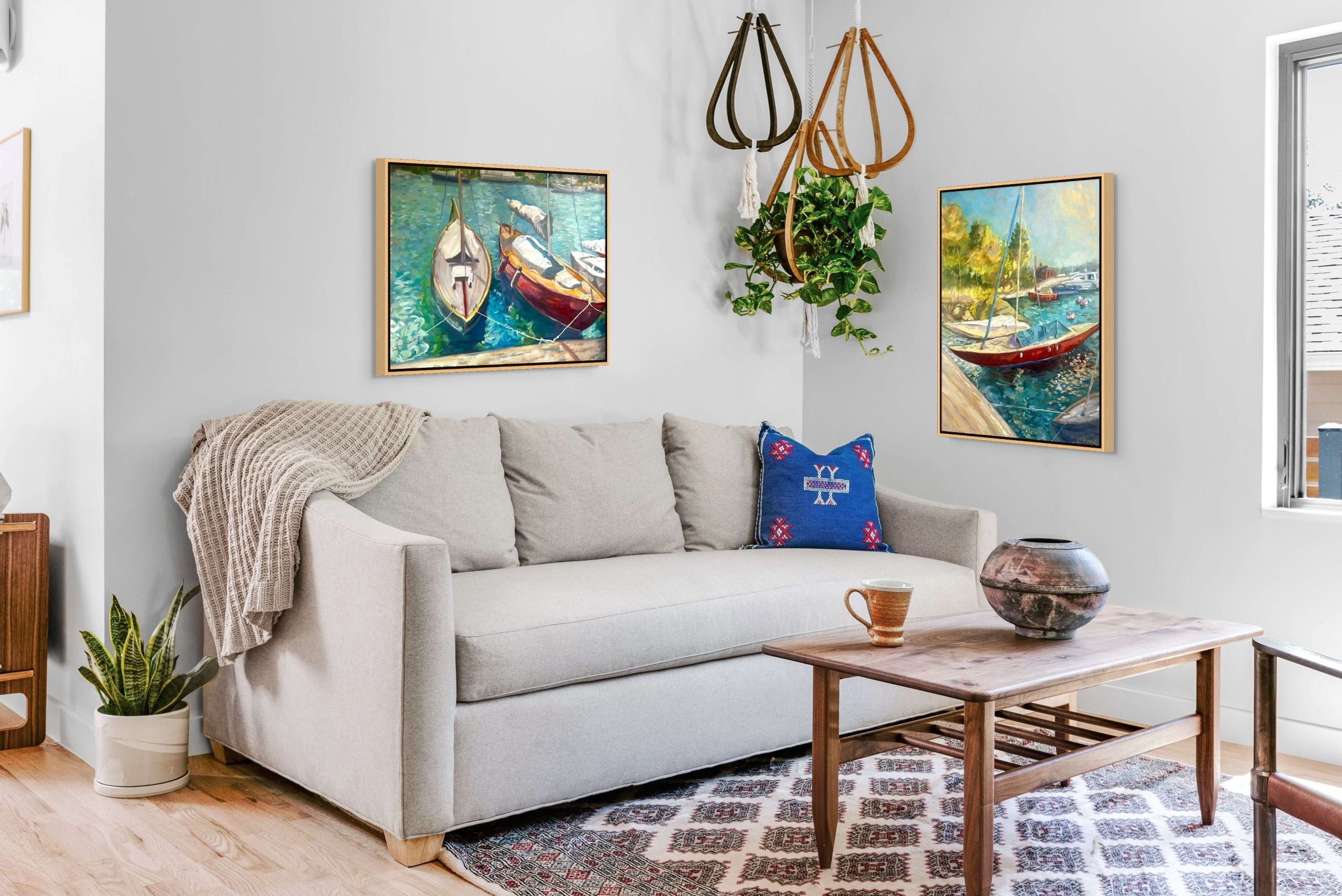 "Aqua Ripples and Dreamboat original oil paintings displayed together in a lounge, Saltsjöbaden Sweden, by Sally Herriott"