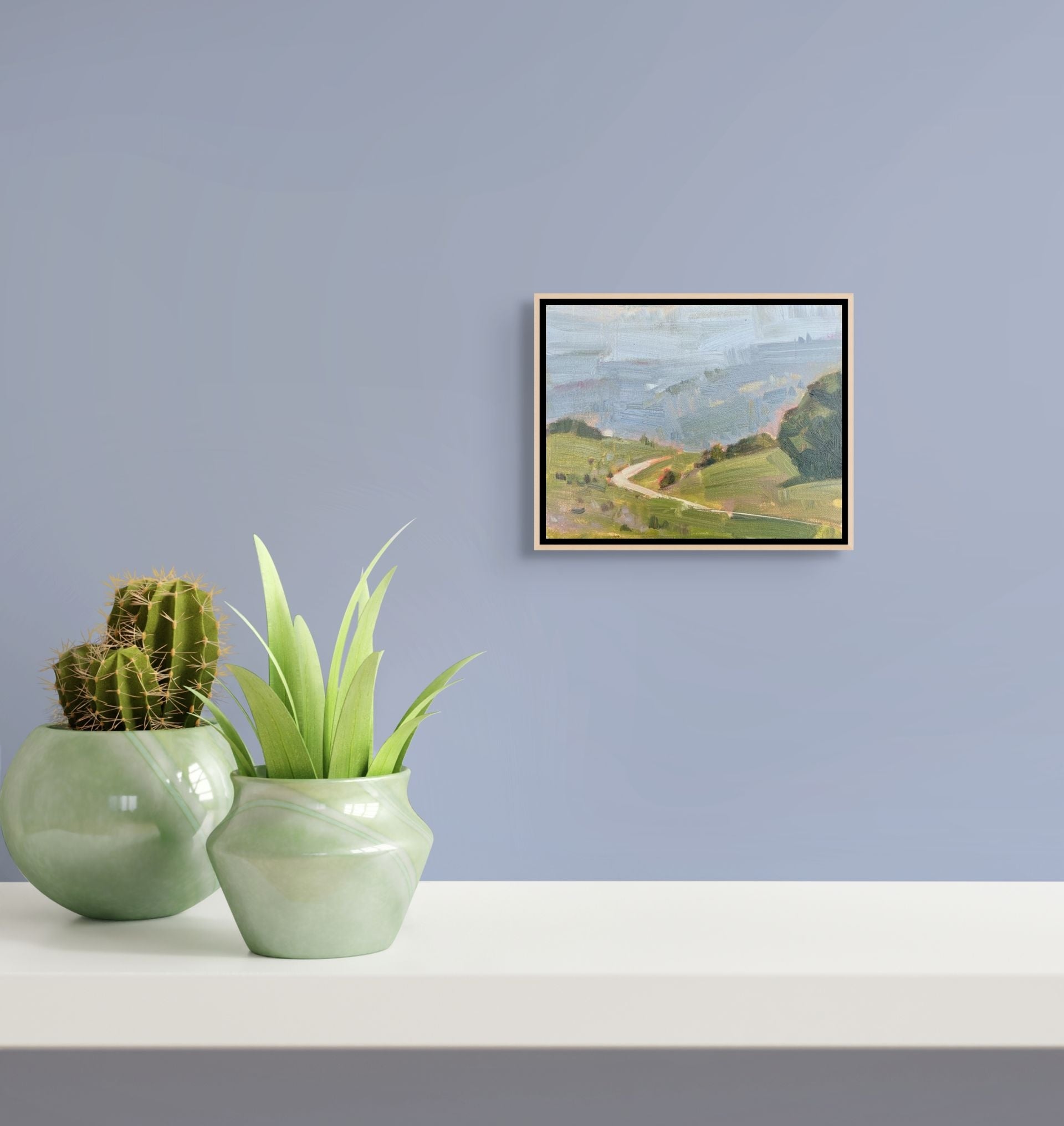 "Fog and Sun in Ojai original oil painting hung on a lavender wall, by Sally Herriott"
