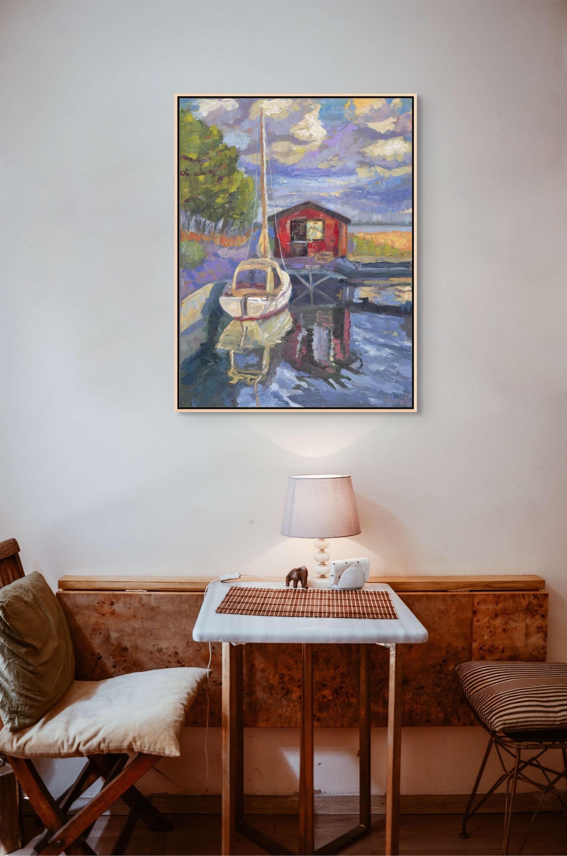 "Purple Skies over Sailboat original oil painting in a coffee nook, by Sally Herriott"