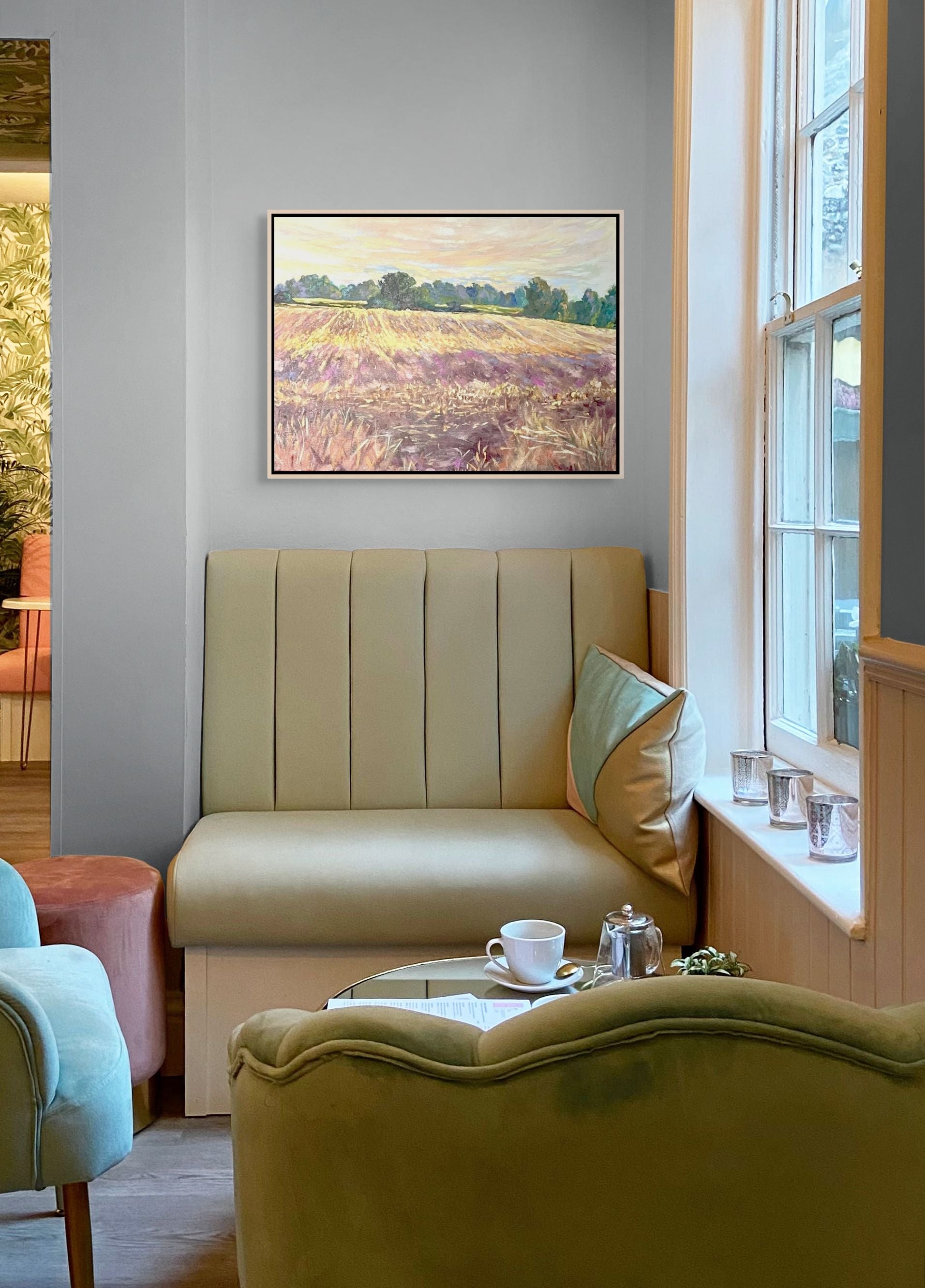 After the Harvest and Morning Meadows original oil paintings in a cosy tea corner, Puy Vidal France, by Sally Herriott
