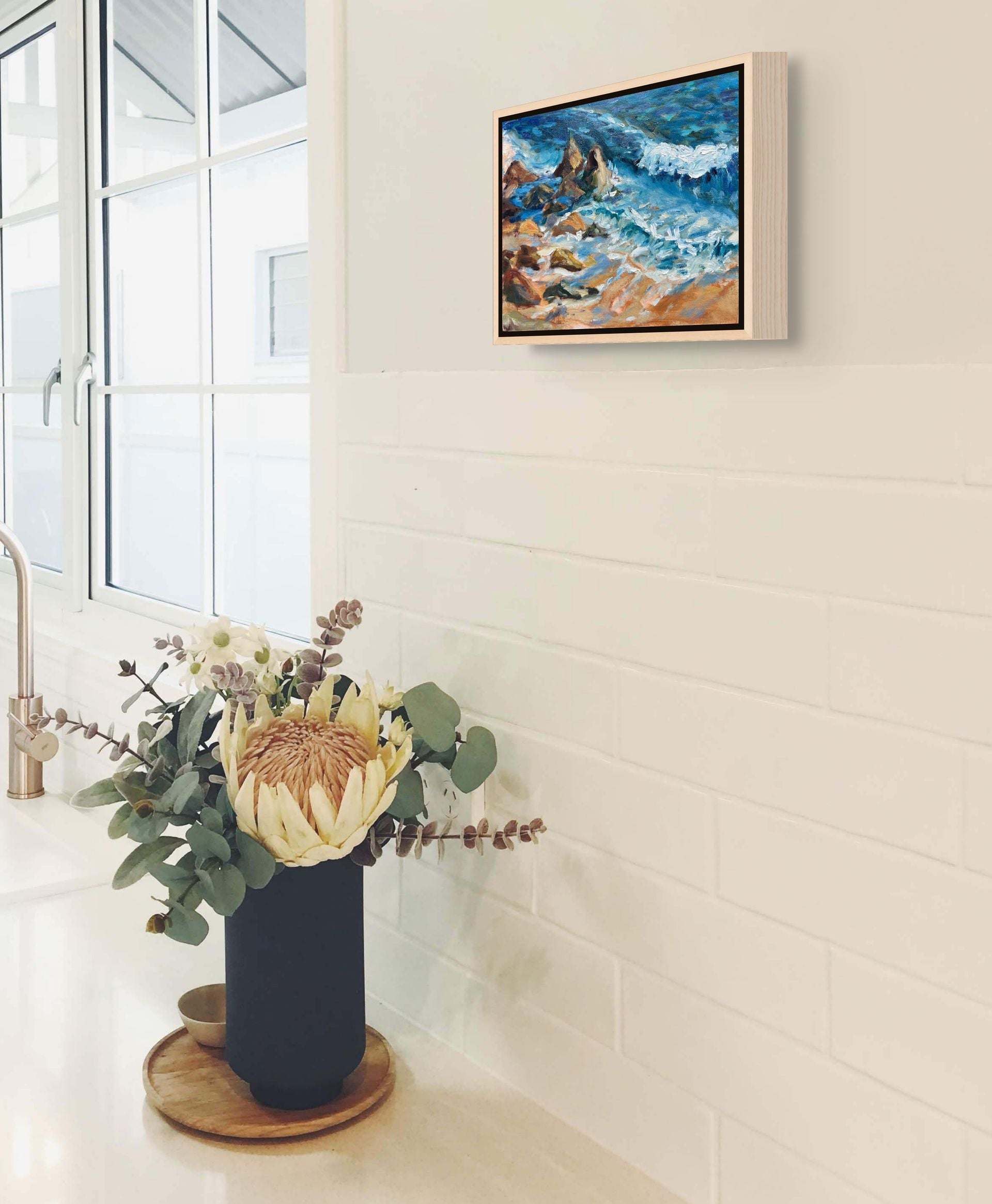 "Swell Waves original oil painting in a kitchen with flowers, by Sally Herriott"