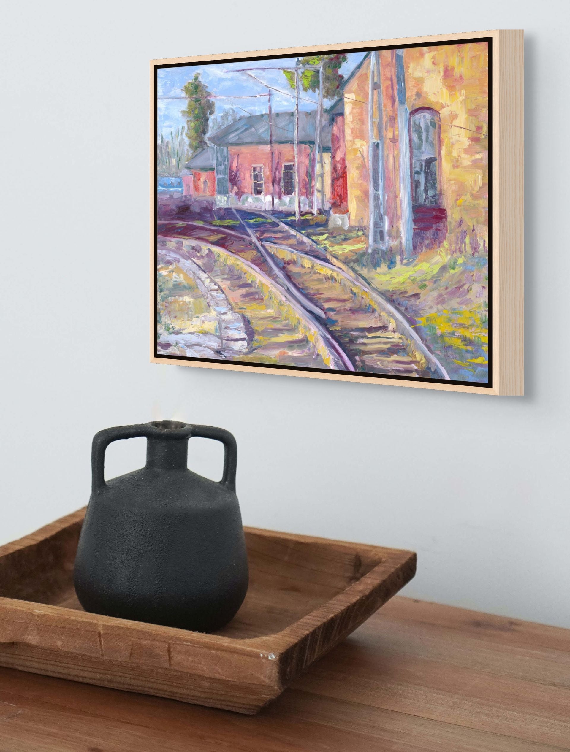 "Technicolor Tracks original oil painting displayed with an antique vase, by Sally Herriott"