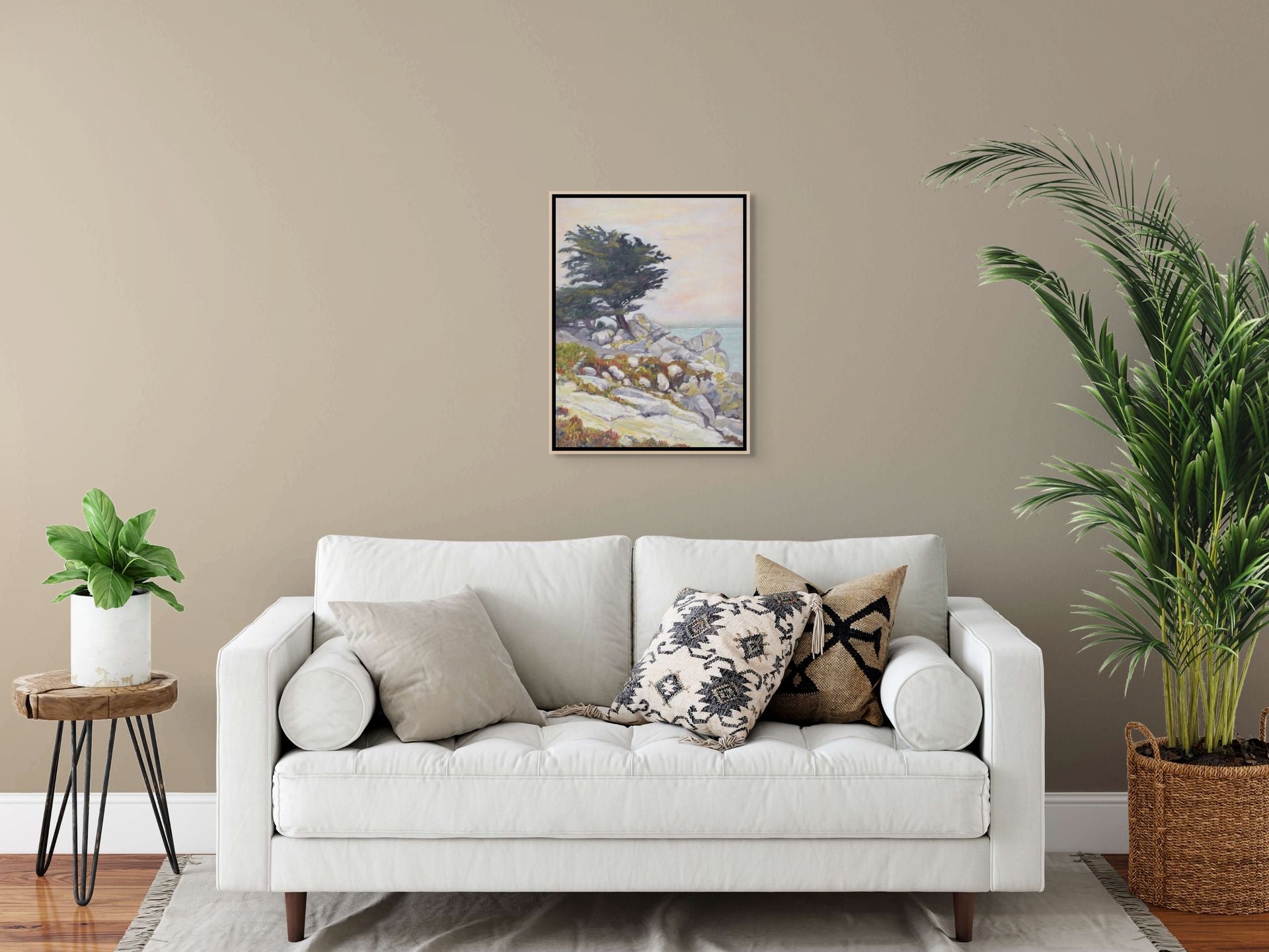 "Under a Winter's Sky original oil painting above a stone colored sofa with plants, by Sally Herriott"
