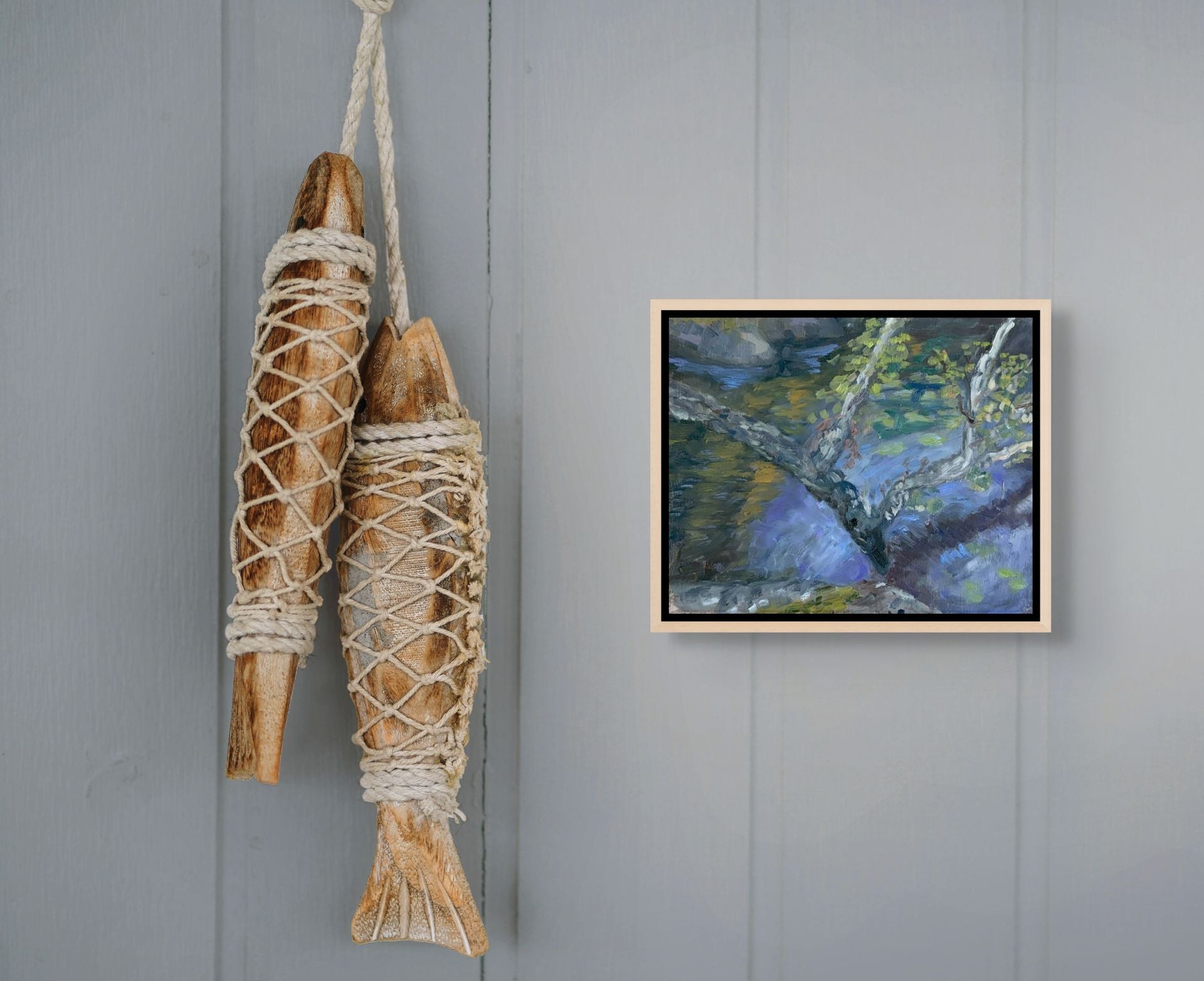  "Whispering Waters original oil painting displayed with a fish decoration, by Sally Herriott"